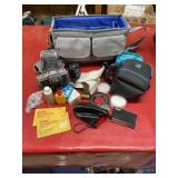 Vintage Minolta camera with case and many