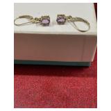 Gold tone with light purple gem stone pierced