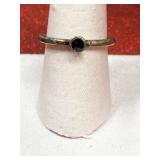 Silver tone ring with dark red stone size 8.25