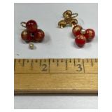 Pair of screw back earrings with red glass balls