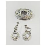 Silver tone earrings with clear stones and