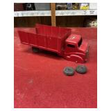Vintage red metal toy truck needs repair