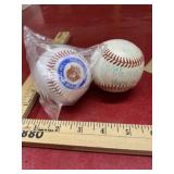 2 baseballs, one is new sealed Smokey Bear