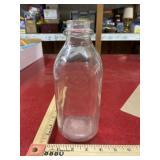 Vintage one quart milk bottle with raised letters