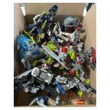 Box full of mixed LEGO Bionicle and Technic
