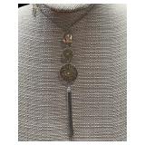 Silver tone and gold tone triple drop & tassel