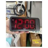 Vintage digital alarm clock powers on