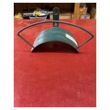 Metal wall-mounted garden hose holder