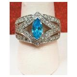 .925 silver ring with light blue gem and clear