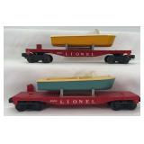 Two postwar Lionel O Gauge 6801 flat car with boat blue & yellow 6418-9 band