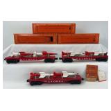 Three postwar Lionel O Gauge 6823 Flat Car with Missile in original box