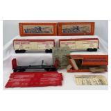 Postwar Lionel O Gauge 6470 and two 6448 Exploding box cars in box