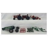 Group of Auburn rubber and Arcade die-cast metal toy farm tractors and implements