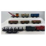 Large group of Marx 4-wheel tab & slot freight cars; 552 x3, three stake side flats, 553, 555, 556, NYC tender, wrecker