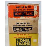 Three variations of postwar Lionel O Gauge No. 112 Remote Control Super "O" Switches in original boxes