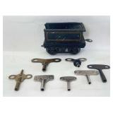 Prewar O Gauge 4 wheel tinplate tender plus seven keys for windup trains, mechanical toys, figures