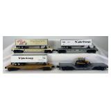 Group of four MTH O Gauge flat cars with trailers and bulldozer
