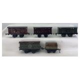 Prewar group of five Gebruder Bing O Gauge freight trains cattle/stock cars, covered wagon w/opening door