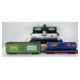 Four pieces of G Scale freight; three tank cars, one box car unmarked