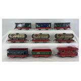 Marx O Gauge freight trains with red lithographed frames; one 552, three 553, four 554, one 556