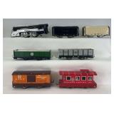 Group of Hafner O Gauge windup 1010 steam loco, two tenders, Bx32 ATSF box, 91876 gondola, 41021 Wyandotte caboose