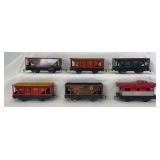 Group of Marx O Gauge 4-wheel 6" freight trains: three 554 variations, two 738701, 20102
