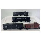 Modern Lionel O Gauge freight trains; three 17128 C&O hoppers w/coal loads and 17611 NYC woodside caboose 6003