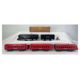 Prewar Lionel O Gauge set 1548 clockwork driven 1588 streamlined steam locomotive and 1588T tender, 1673 and 1674 coaches, 1675 observation, one original 1673 sleeve