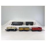 Prewar Lionel O Gauge 1668E 2-6-2 steam locomotive and tender, 1679 Baby Ruth, 1680 Sunoco, 1682 caboose