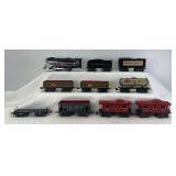 Marx O Gauge Marlines electric 0-4-0, CP & NYC tenders, 552 Rock Island, 554 General Coal, flat car w/load restraint, two 556 caboose 3/16" scale 8-wheel trains