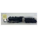 Postwar Lionel O Gauge 1665 0-4-0 Lionel Lines steam switcher locomotive with 2403B bell ringing tender