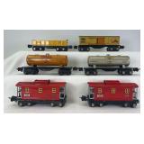 Prewar Lionel O Gauge 2652 gondola, 2679 Baby Ruth, 2680 Shell, 2680 Sunoco, two 2657 caboose freight