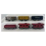 Marx/Joy Line O Gauge freight cars with black lithographed frames; 552, 91453, 1678, two 694, 551 tender