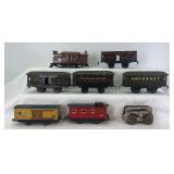 Prewar Ives O Gauge 3250 NYC&HR center cab electric, 550 mail/baggage, 551 Chair Car, 62 Parlor Car, 60 mail/baggage, 1514 Erie box, 1517 NYC caboose