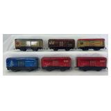 Group of six Marx O Gauge 4-wheel 6" lithographed tinplate box, refrigerator, stock cars