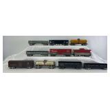 Group of ten Marx O Gauge 8-wheel 8" freight trains: short and tall sided gondolas, hopper, box, tank, caboose
