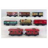 Group of eight Marx O Gauge freight trains; 552, 553, 554, 555 (man in door), two 557, two 90171 (one red)