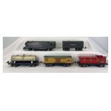 Prewar Lionel O Gauge 1668E 2-6-2 steam locomotive and tender, 1679 Baby Ruth, 1680 Sunoco, 1682 caboose