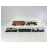 Marx O Gauge 3/16" 8-wheel freight: NKP2700 flat w/stakes, 3552 NKP gondola, two 256 Niacet tanks, 355 AT&SF 13549 stock car