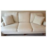 Cream Upholstered Sofa with Wooden Legs