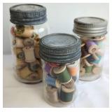 Thread Spools in Glass Jars