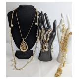 An Assortment of Gold-Tone Costume Jewelry Necklac