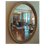 A Gilded Composition Oval Wall Mirror