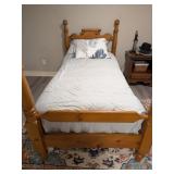 A Colonial Revival Style Stained Wood Twin Bed