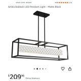 An Artika Matte Black Integrated LED Pendant