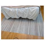 A modern machine-woven area rug