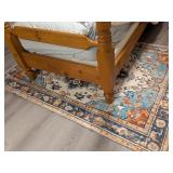 A Machine-Made Polyester Area Rug