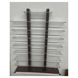 Plastic display with 9 shelves. Top shelf is 10