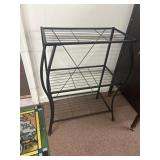 Black, metal shelf. 22 in by 32 in.