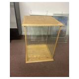 Square glass case with wood trim. 2 ft wide and 2